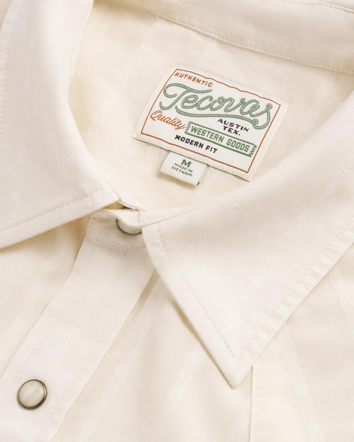 Closeup detail view of Men's Vintage Weight Short Sleeve Pearl Snap - Light Sand/Multi