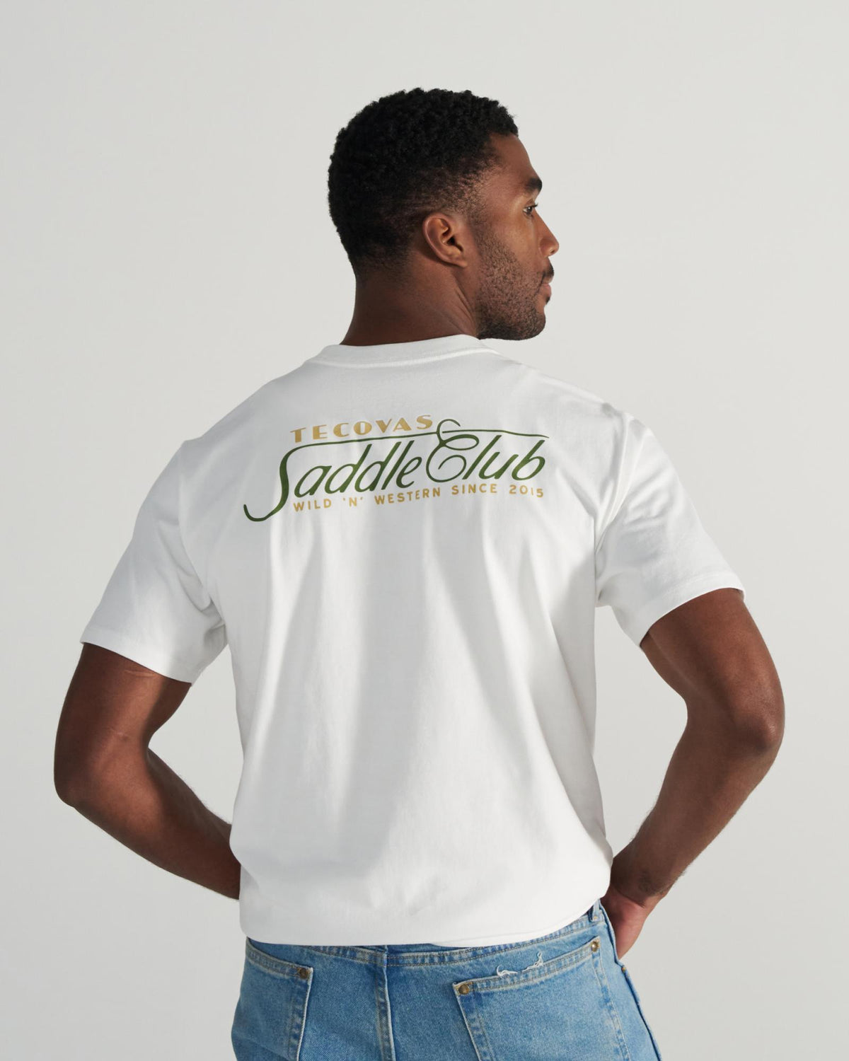 Back view of Men's Saddle Club T-Shirt - Bone/Multi on model