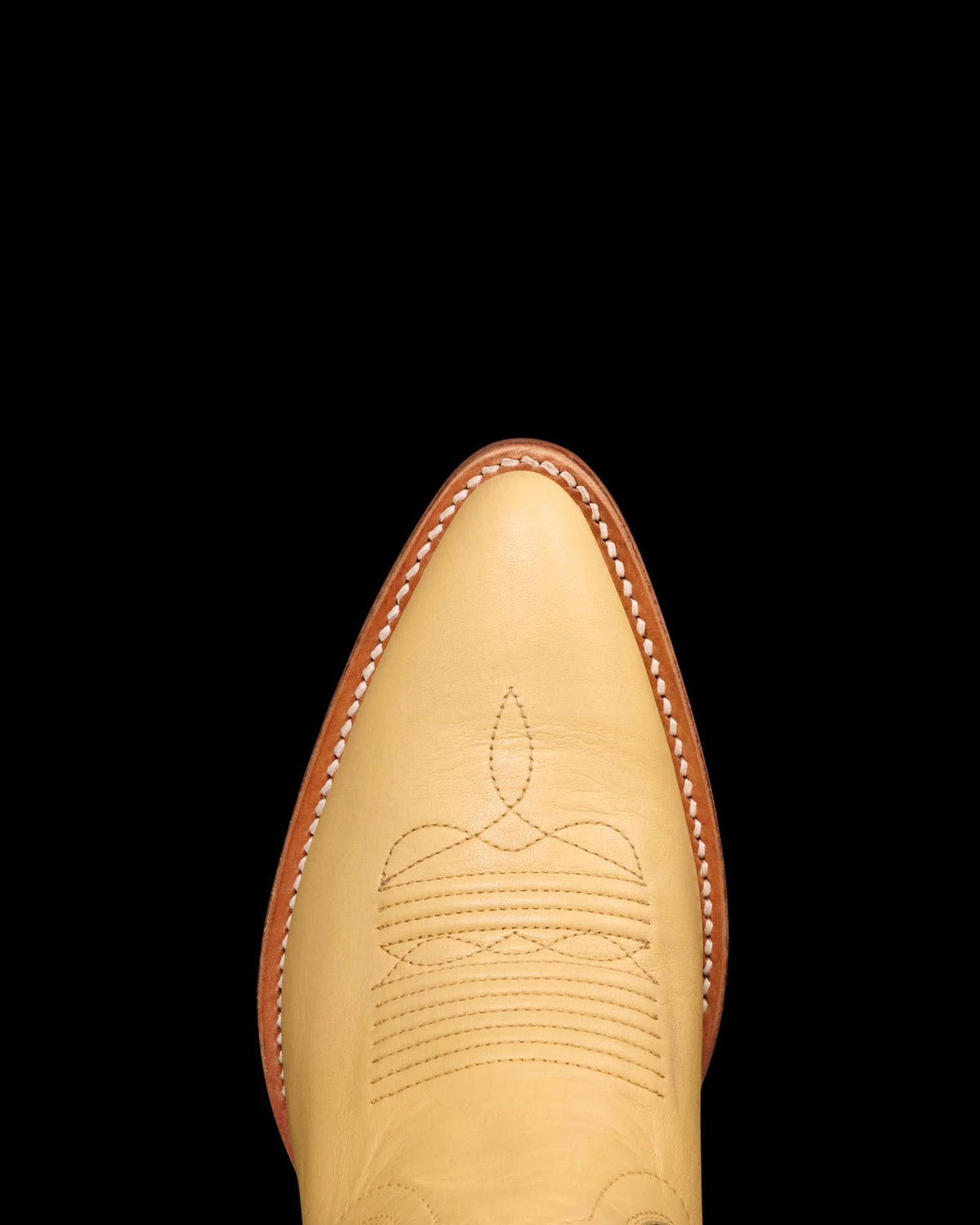 Toe view of The Jolene - Pale Yellow Cowhide on plain background
