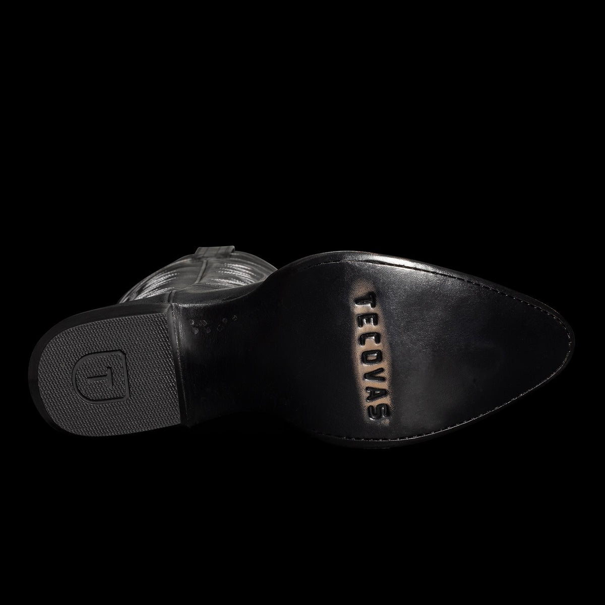 Sole of a black cowboy boot with "TECOVAS" engraved on the heel.