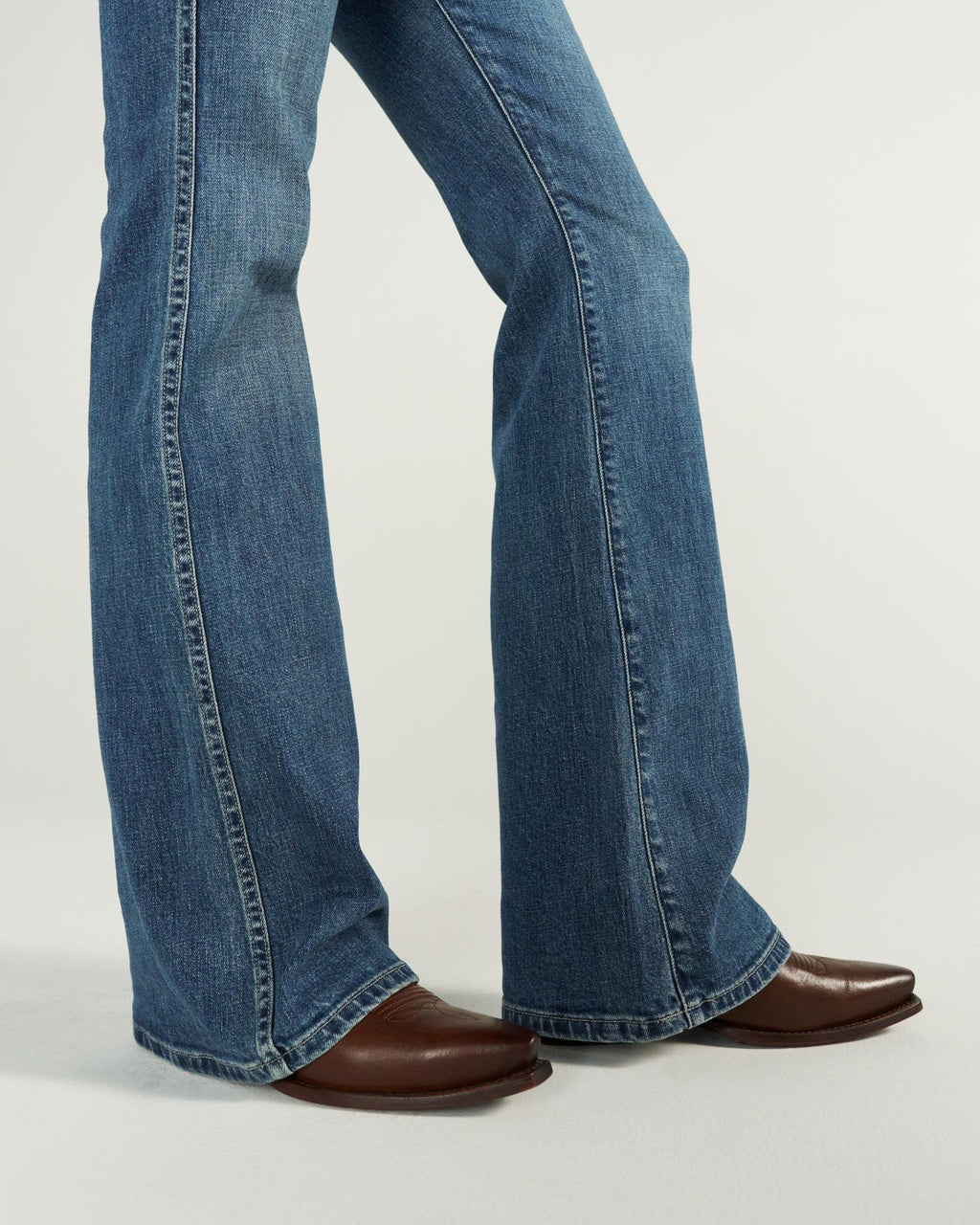 Closeup view of Women's Mid-Rise Slim Flare - Medium Wash