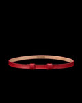 A red leather belt with a simple buckle and “Tecovas” branding on the inner side, displayed on a plain white background.