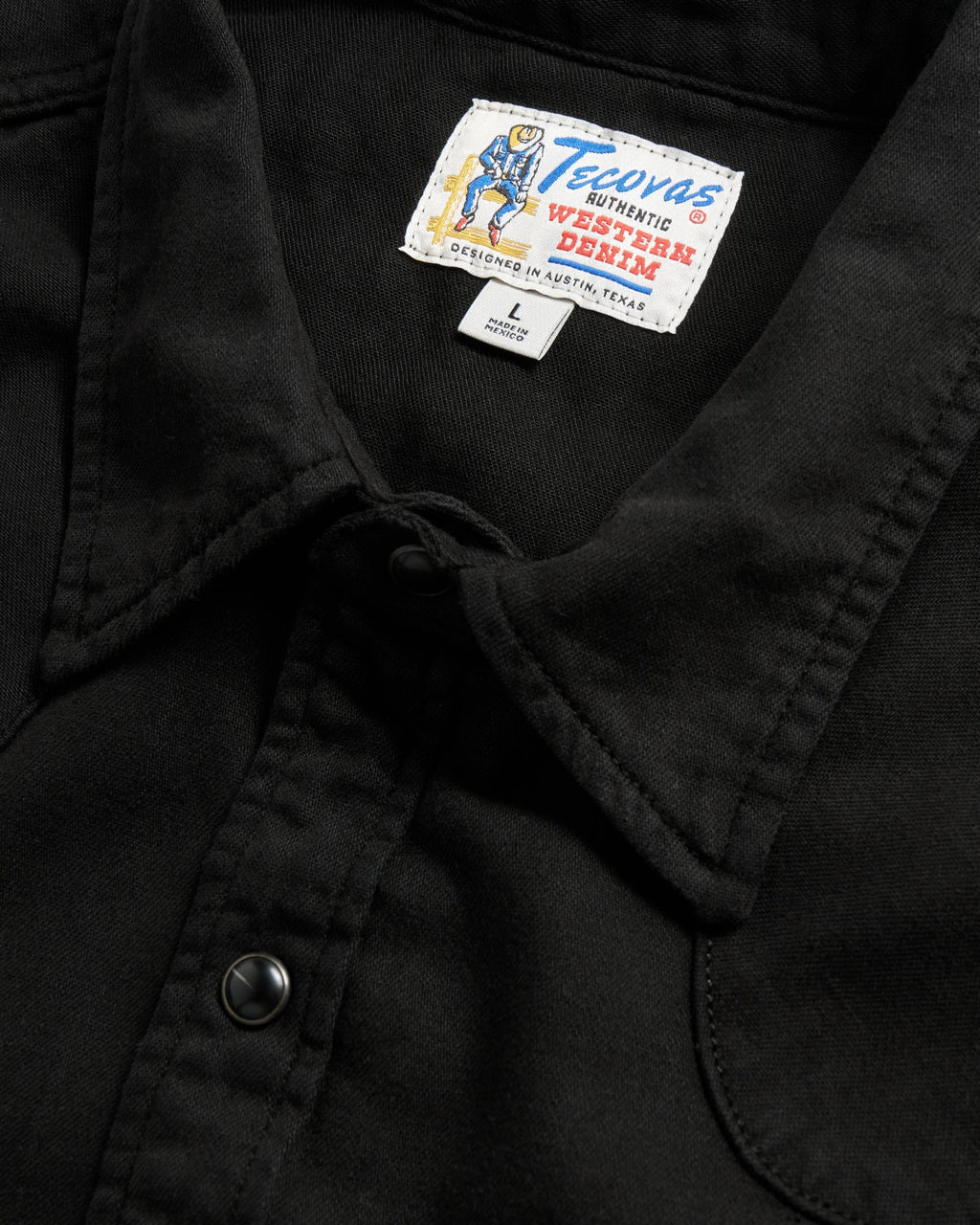 Closeup detail view of Men's Denim Pearl Snap SS - Black
