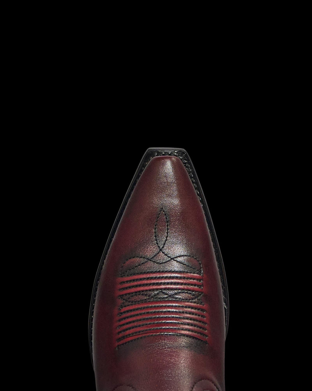Toe view of The Annie - Black Cherry Cowhide on plain background