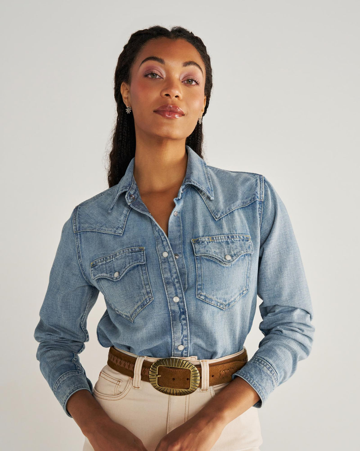 Closeup detail view of Women's Denim Pearl Snap - Light Wash