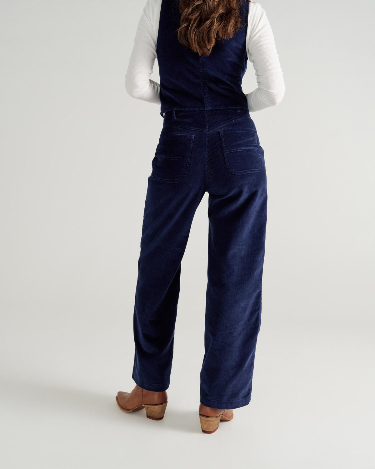 Back view of Women's Corduroy Carpenter Pant - Navy on model