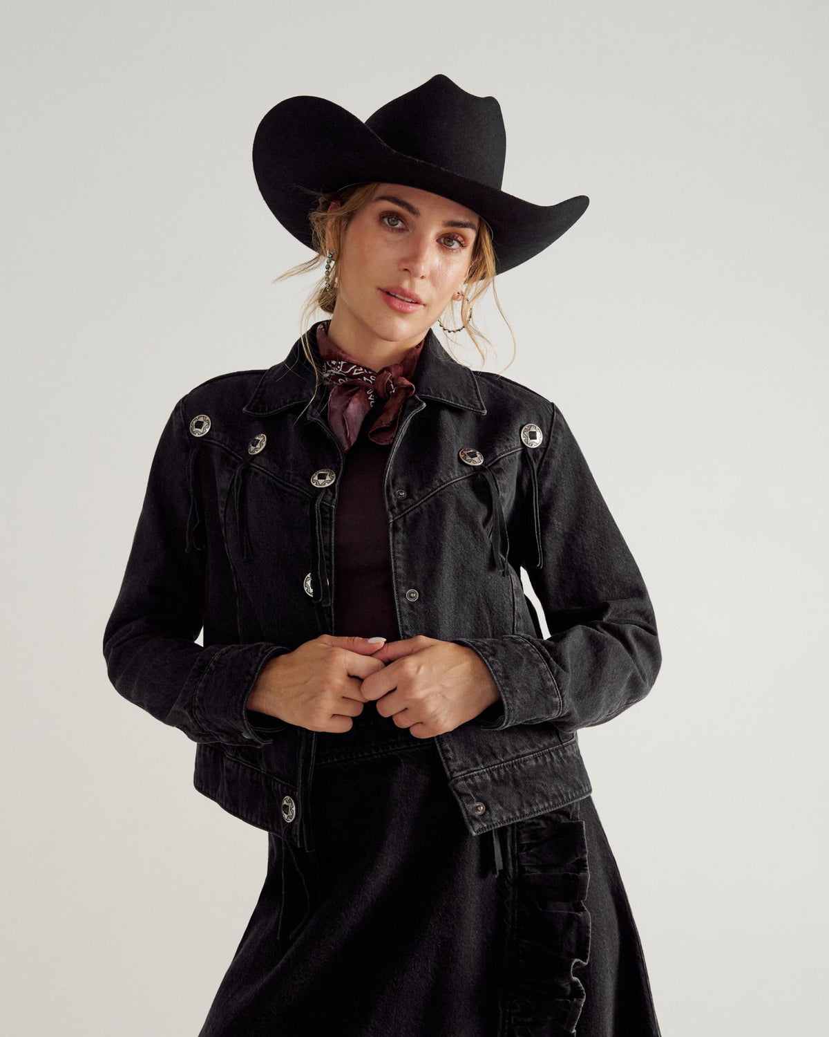 Front view of Women's Rodeo Concho Denim Jacket - Black on model