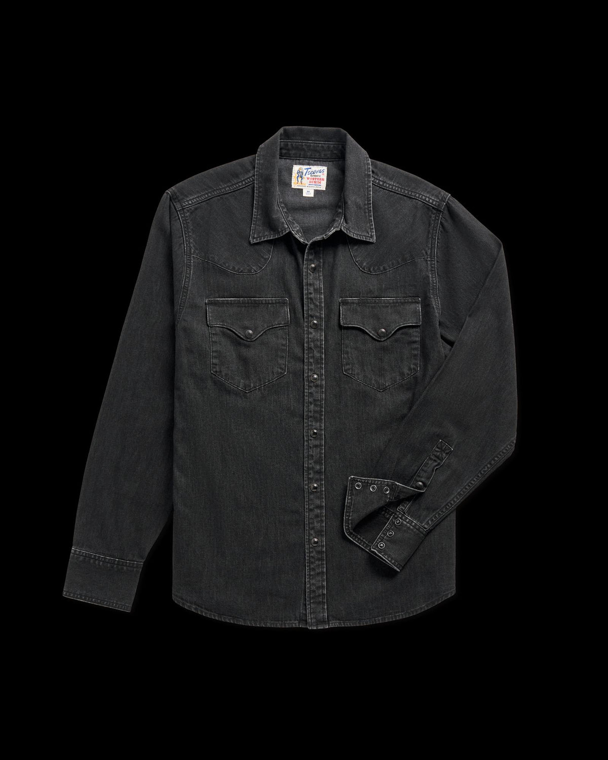 Long-sleeve black denim shirt with snap buttons and two chest pockets, laid flat on a white background.