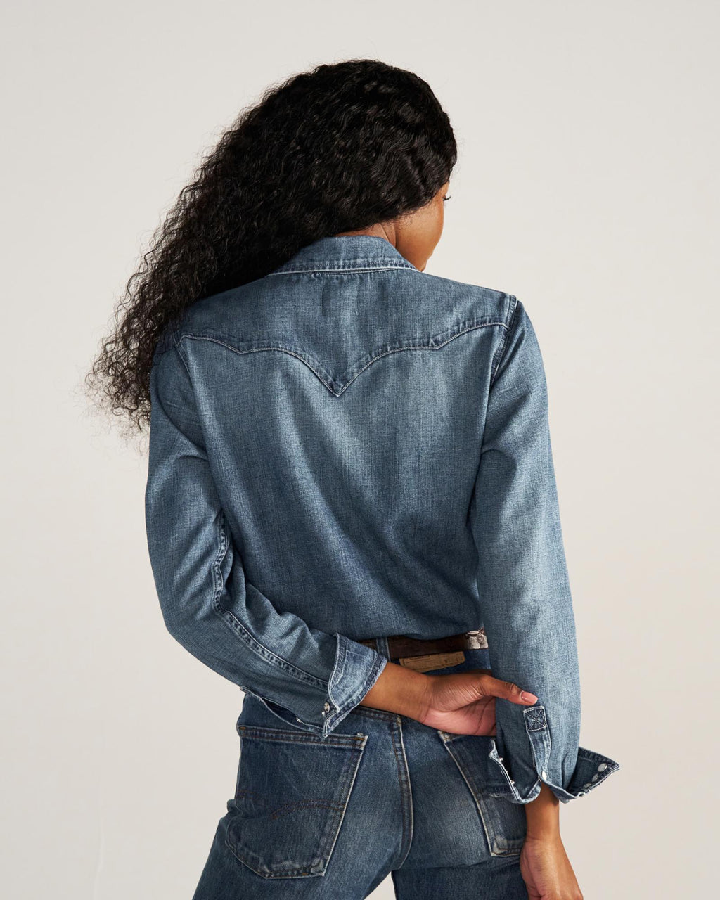 Closeup detail view of Women's Denim Pearl Snap (III) - Medium Wash
