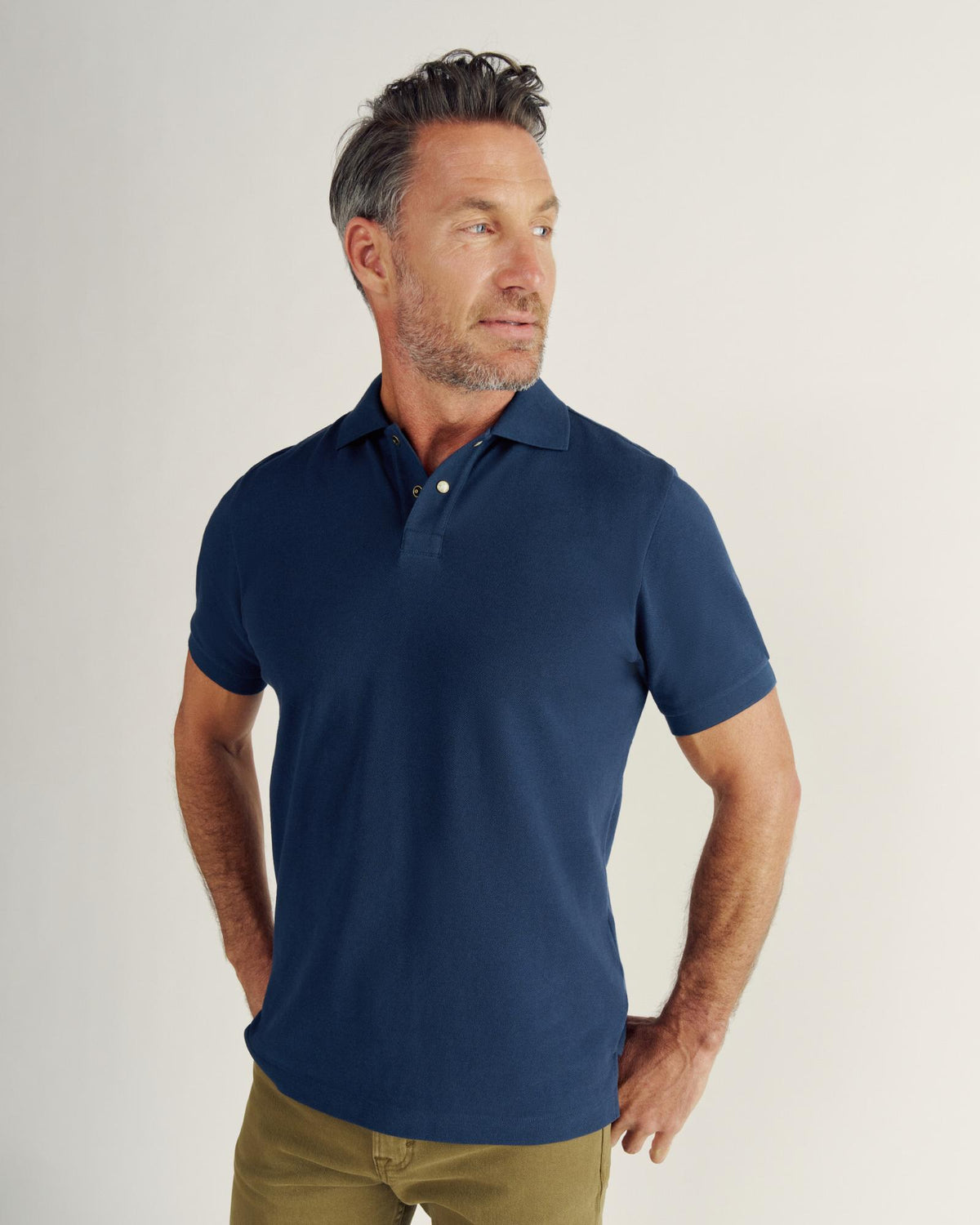 Closeup detail view of Men's Polo Pearl Snap SS - Navy
