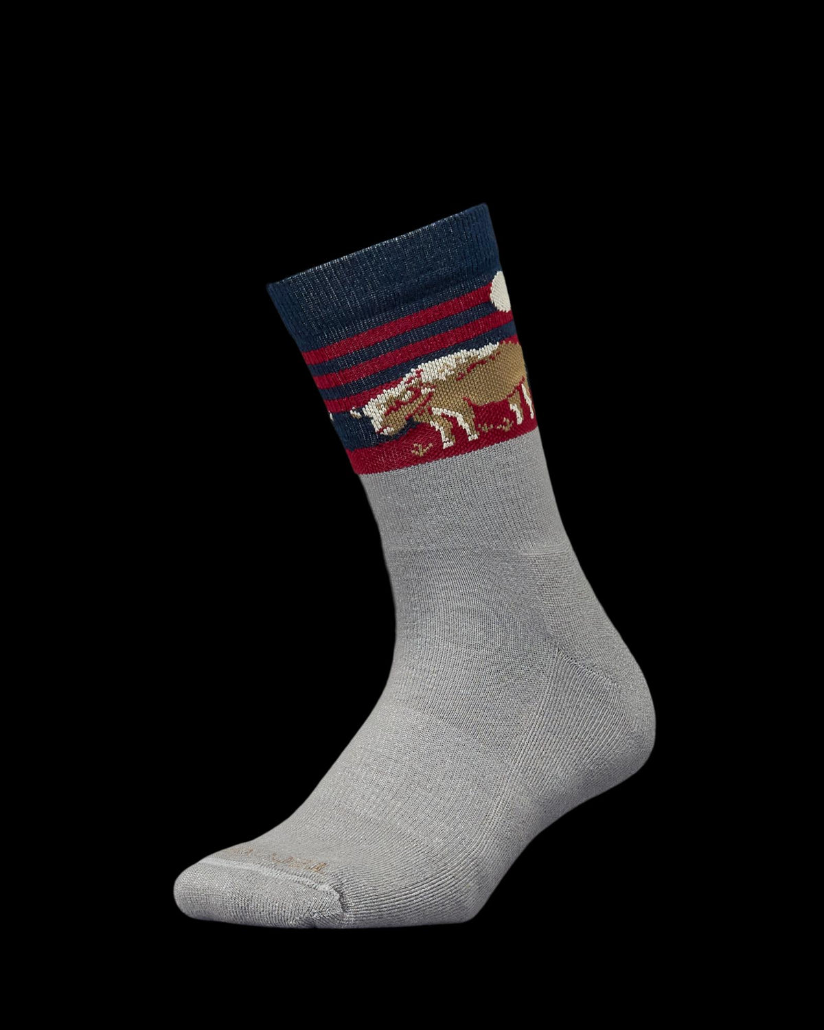 Gray sock with a navy and red striped cuff, featuring a bear and moon design near the top.