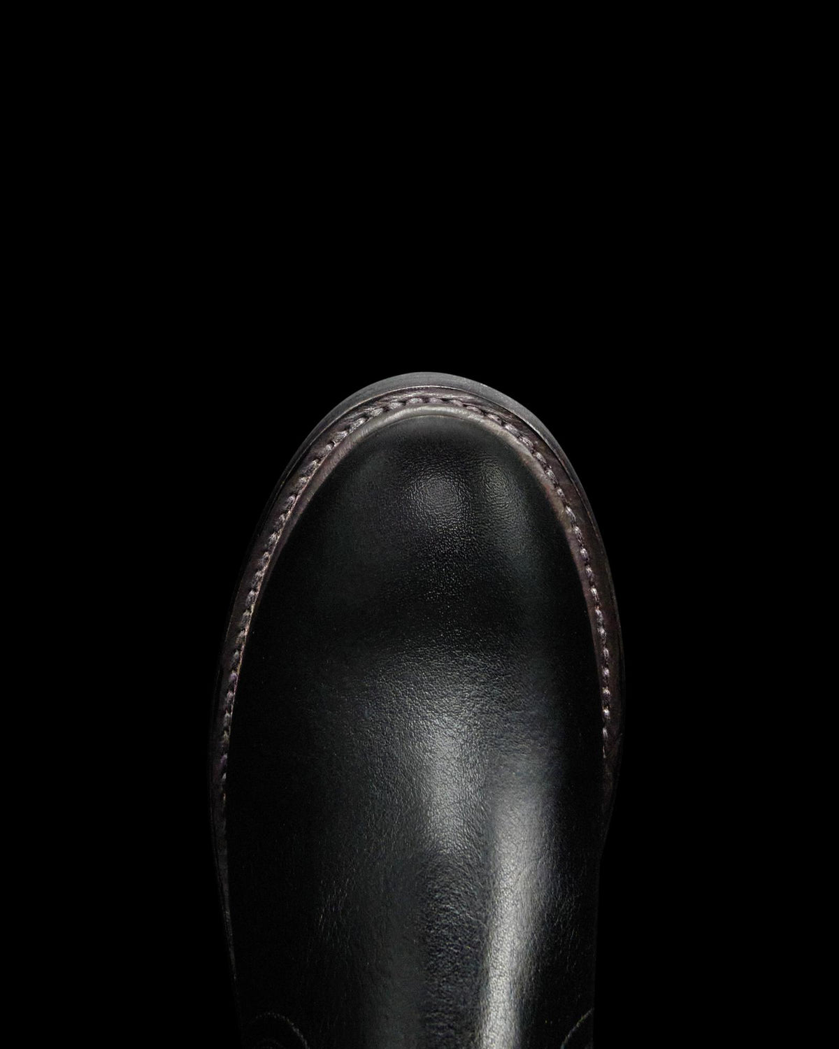 Toe view of The Rugged Chelsea - Midnight Cowhide on plain background