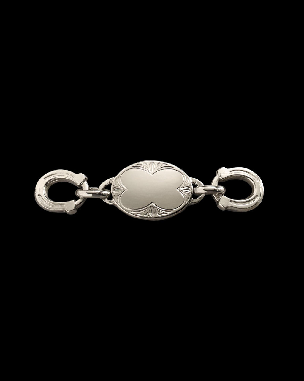 Silver oval jewelry clasp with engraved edges and two circular fasteners on each end, displayed on a plain white background.