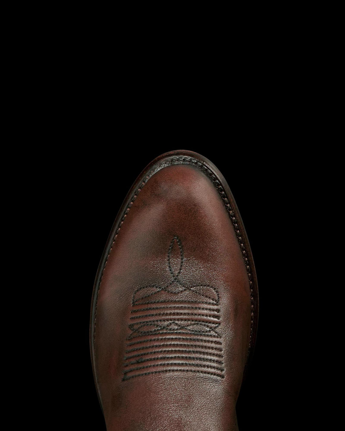 Toe view of The Cartwright - Iced Tea Cowhide on plain background
