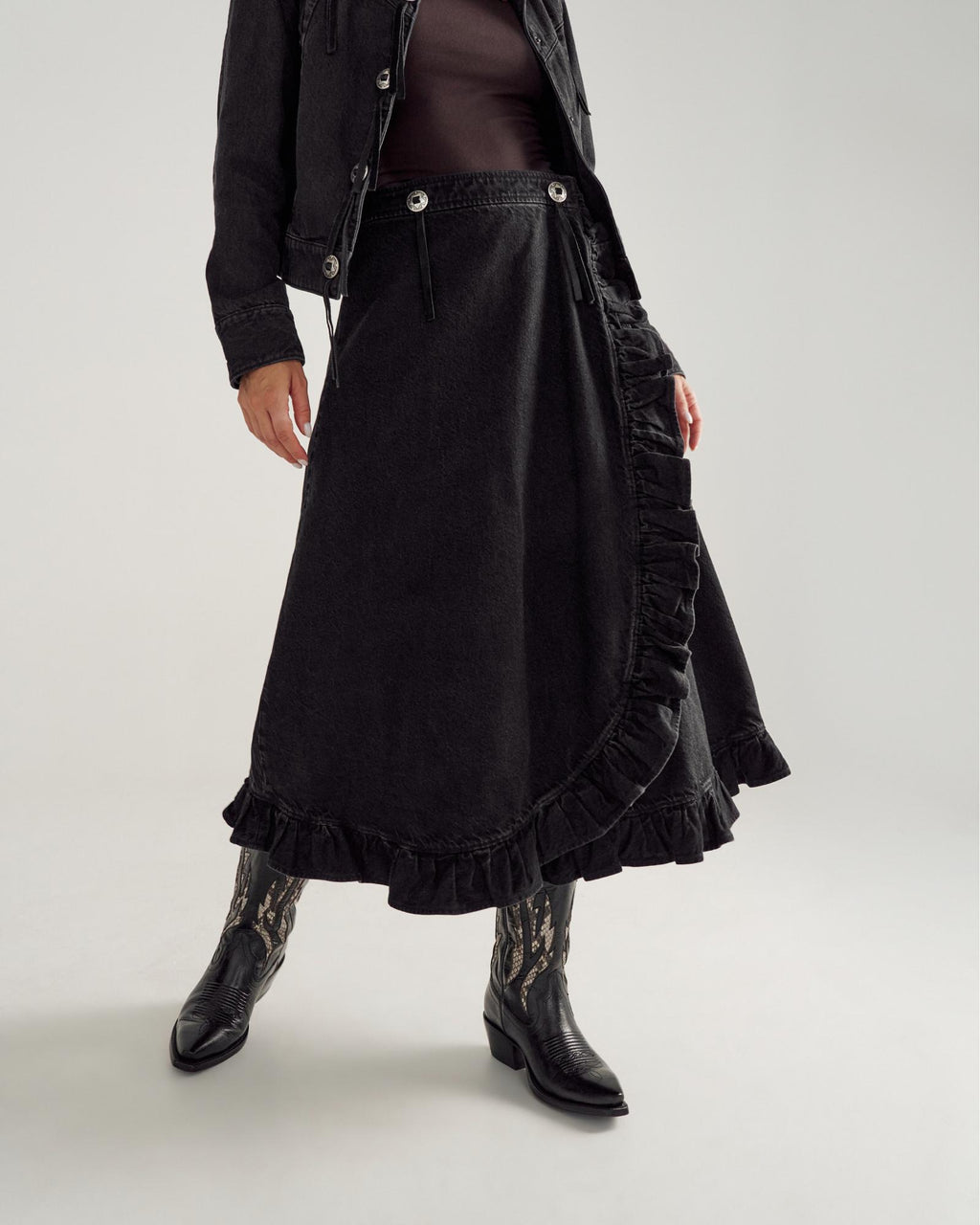 Front view of Women's Rodeo Maxi Denim Skirt - Black on model