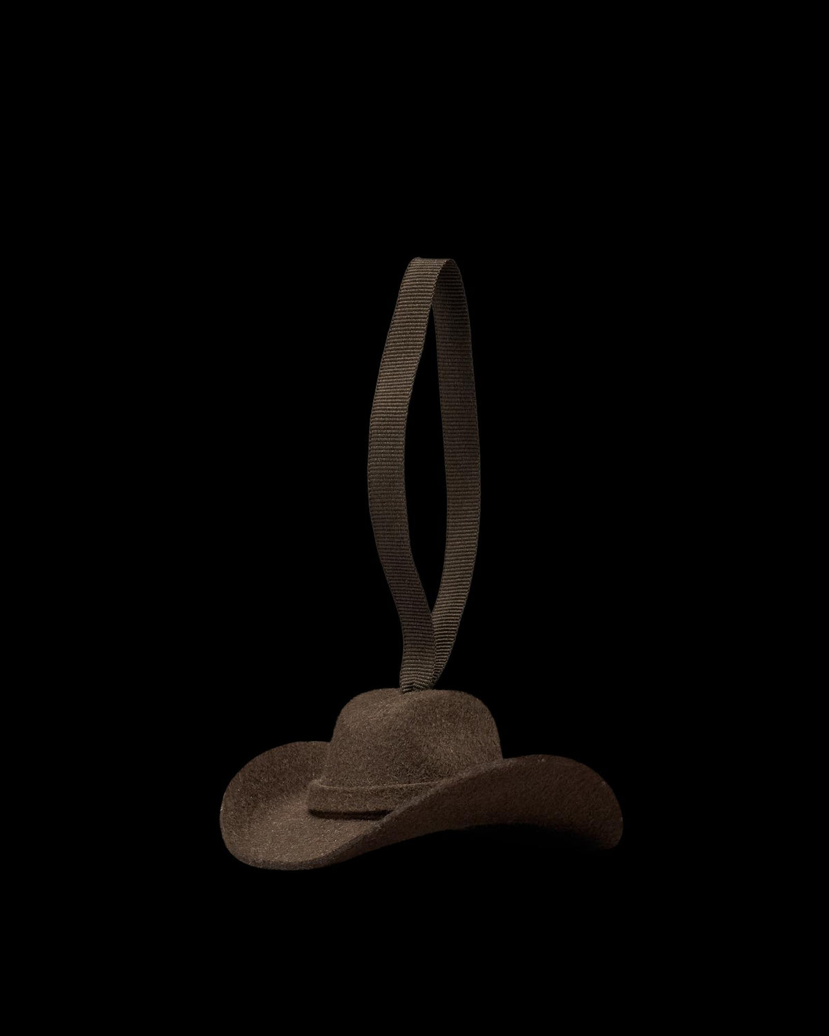 Quarterfront view of Cattleman Hat Ornament - Brown on plain background