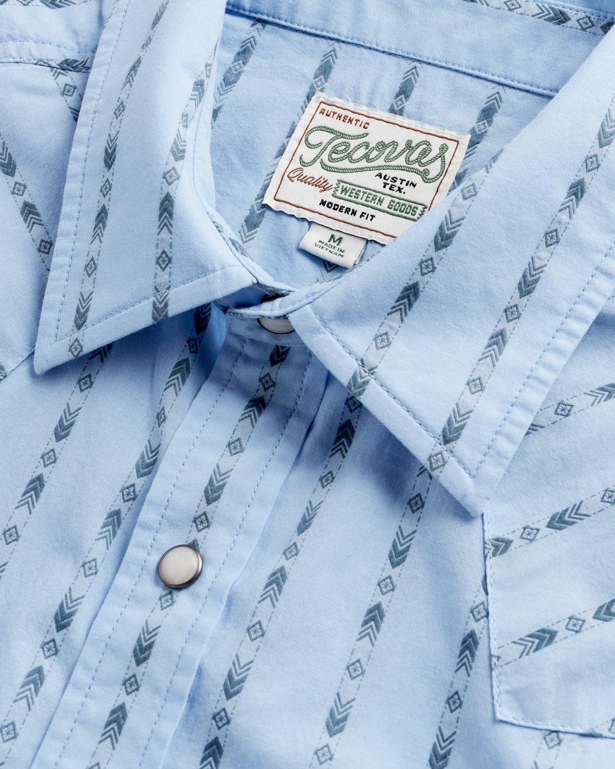 Closeup detail view of Men's Vintage Weight Pearl Snap LS - Chambray / Storm