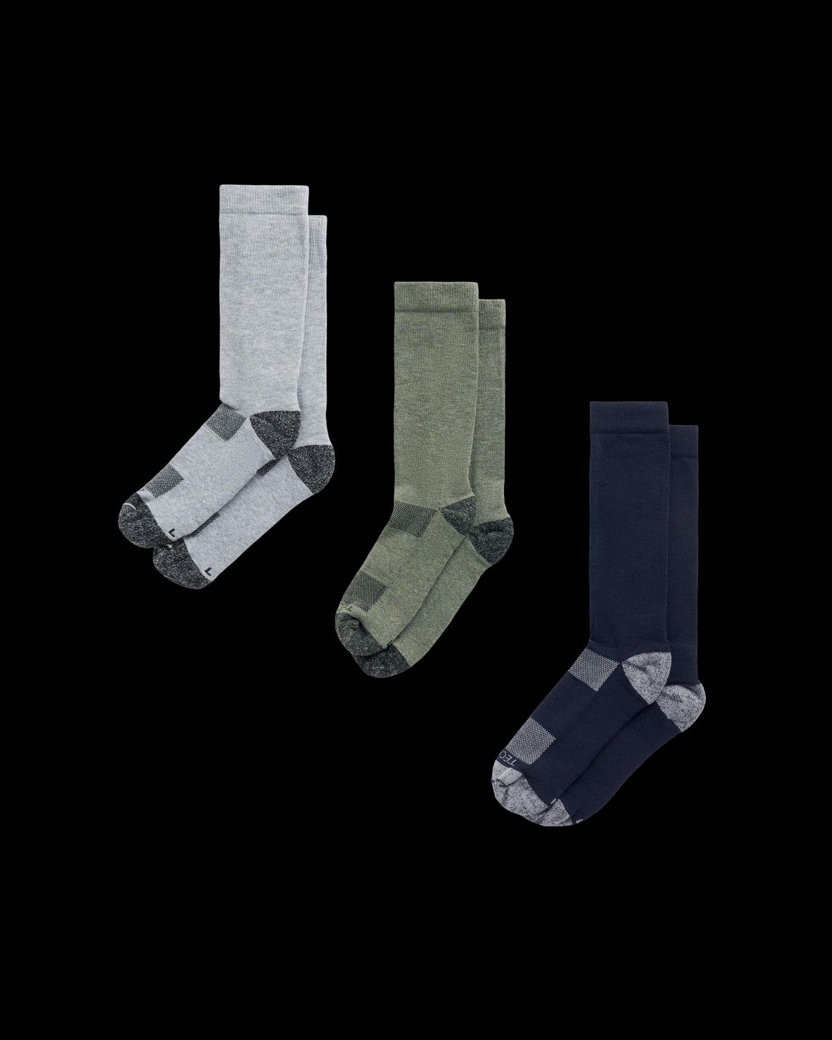Three pairs of crew socks in light gray, olive green, and navy blue, each with dark gray accents on the toe and heel, displayed against a white background.
