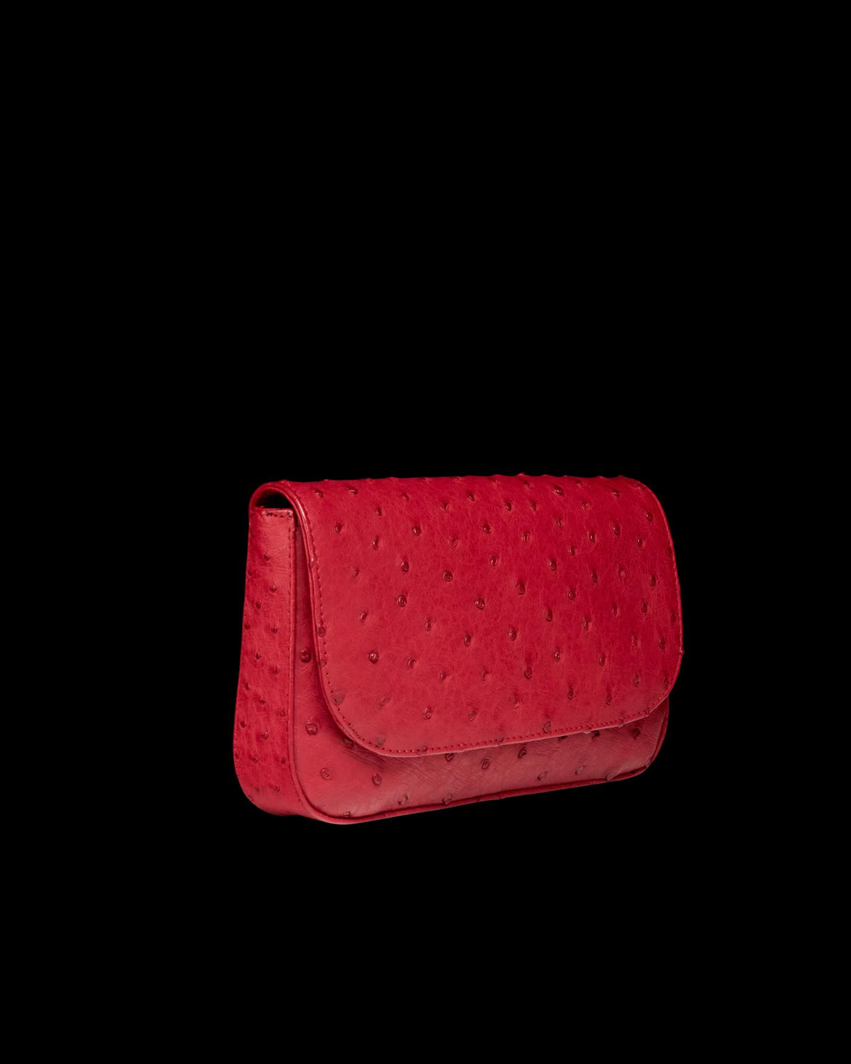 Quarterfront view of Ostrich Flap Shoulder Bag - Barn Red on plain background