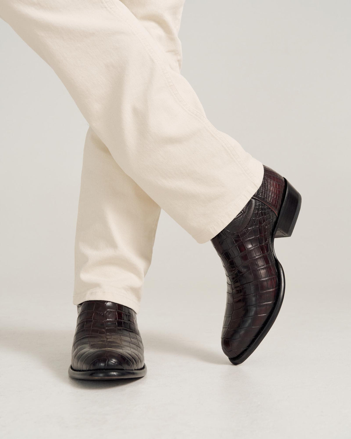 close up of Cooper Black Cherry Cowboy Boot on a man's feet 