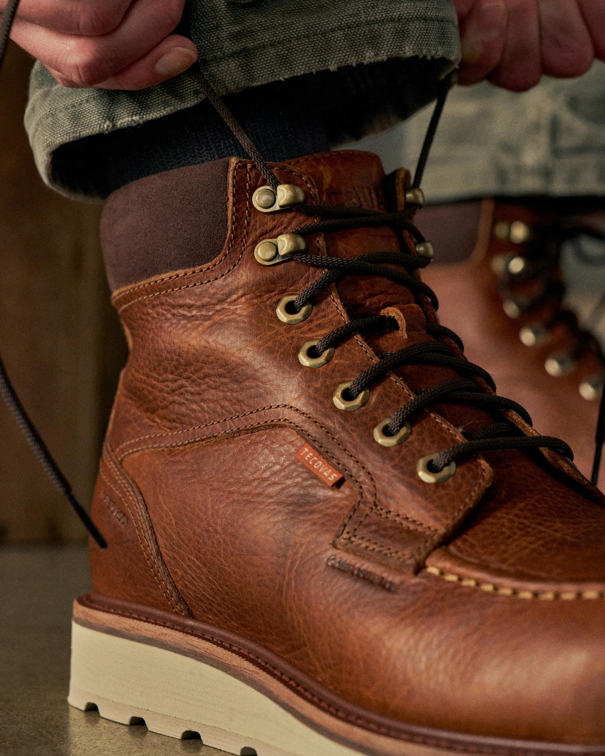 Toe view of The LH WP Moc Comp Toe Work Boot - Saddle Cowhide on plain background