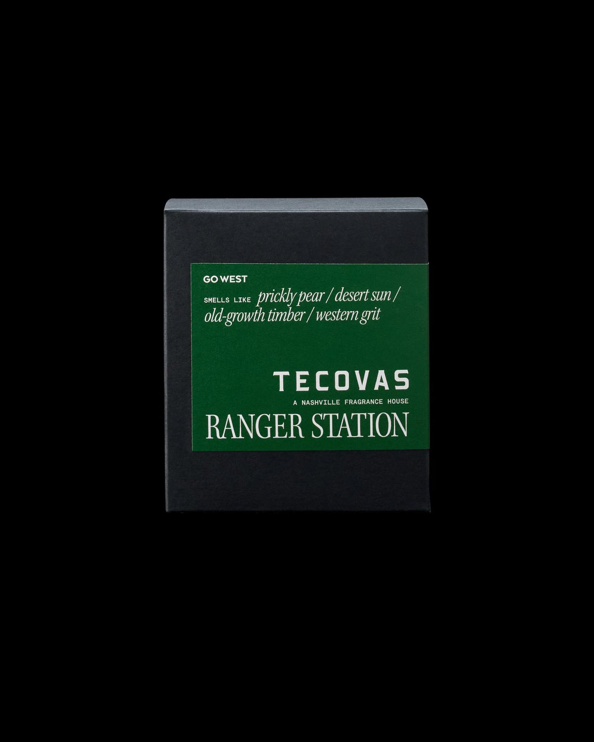Black box with a green label, featuring the text: "Go West," "smells like prickly pear / desert sun / old-growth timber / western grit," and "Tecovas Ranger Station.