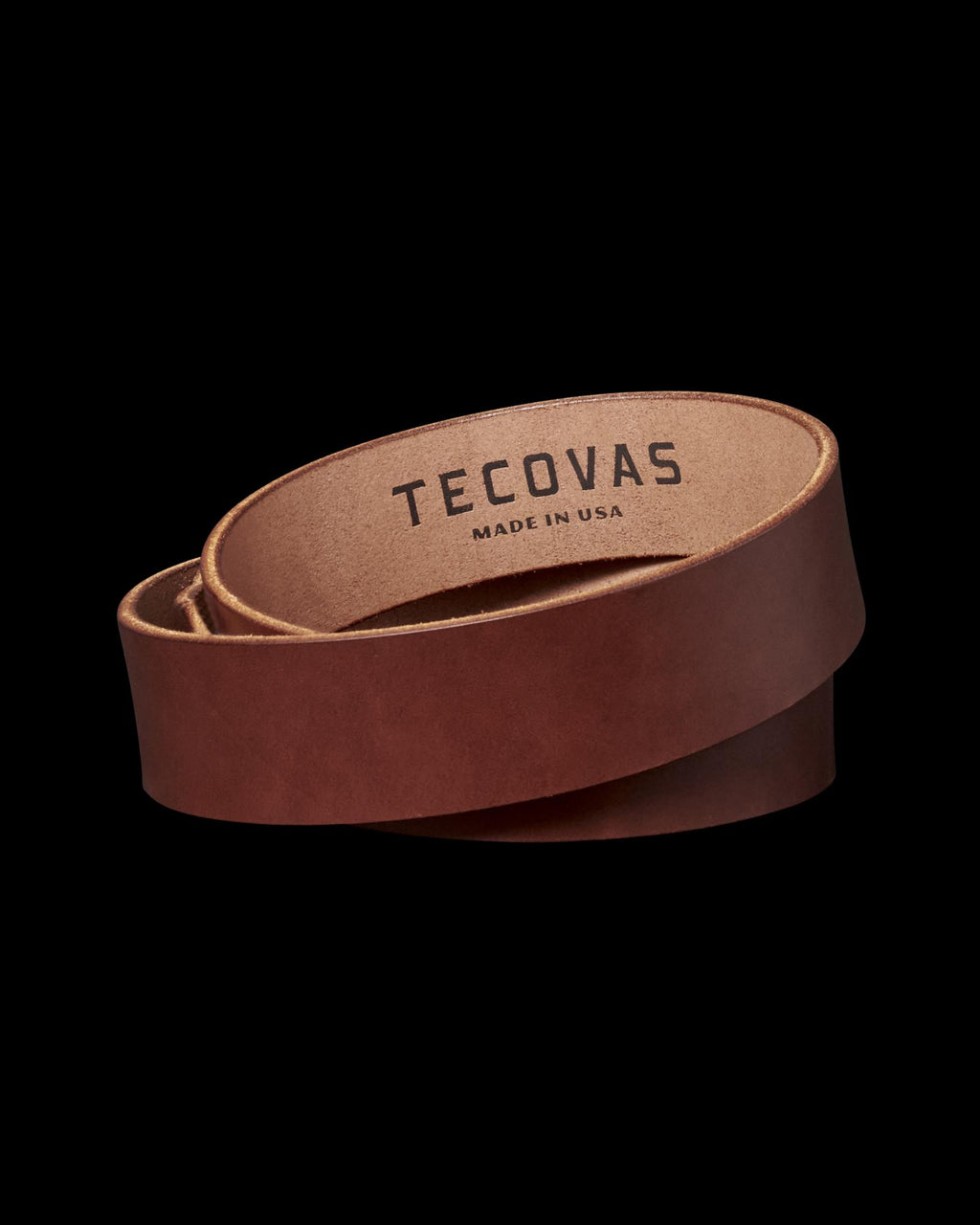 Brown leather belt with "Tecovas Made in USA" text on the inside.
