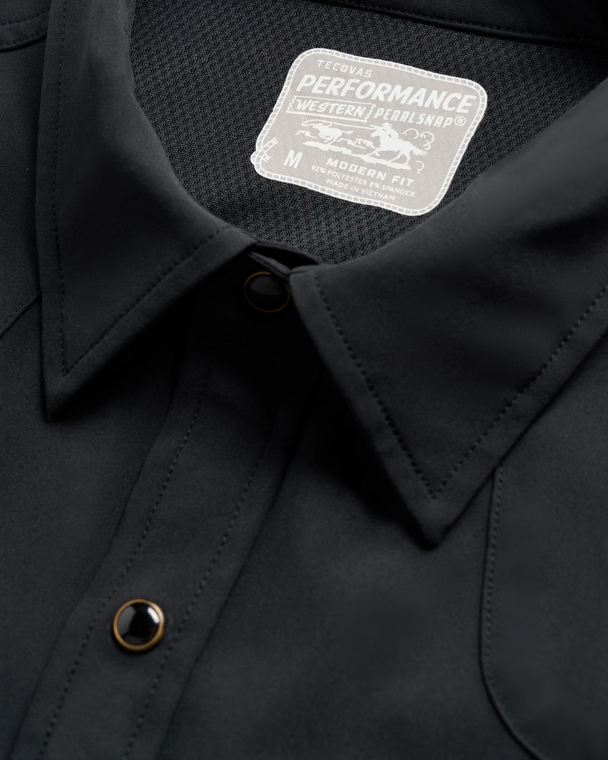 Closeup detail view of Men's Performance Western Pearl Snap SS - Black