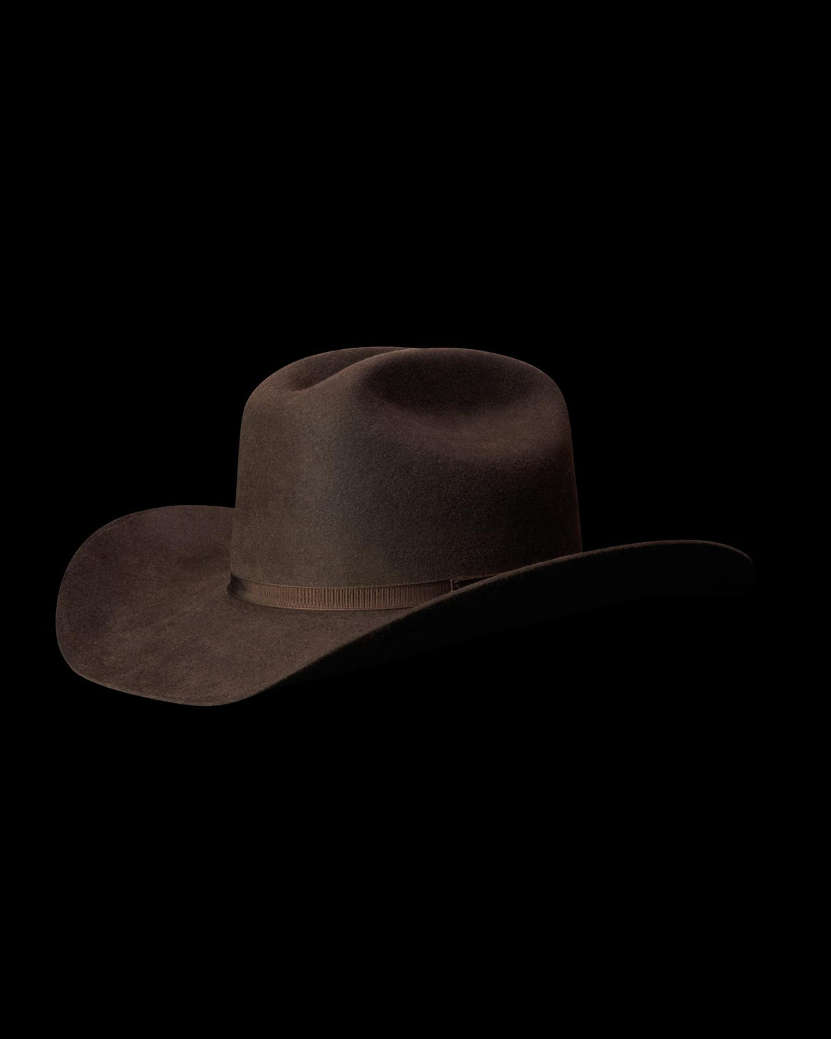Quarterfront view of Cattleman Fur Cowboy Hat - Umber on plain background
