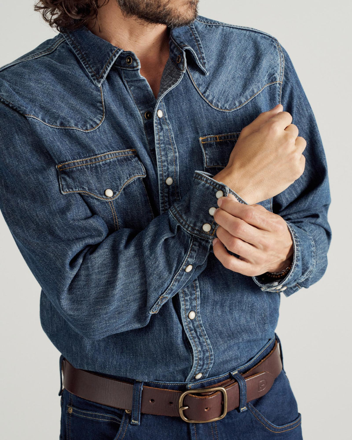 Closeup detail view of Men's Long Sleeve Denim Pearl Snap - Dark Wash