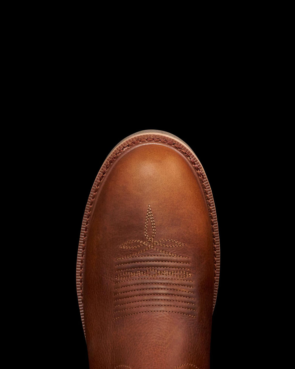 Toe view of The LH WP Round Comp Toe Work Boot - Saddle Cowhide on plain background