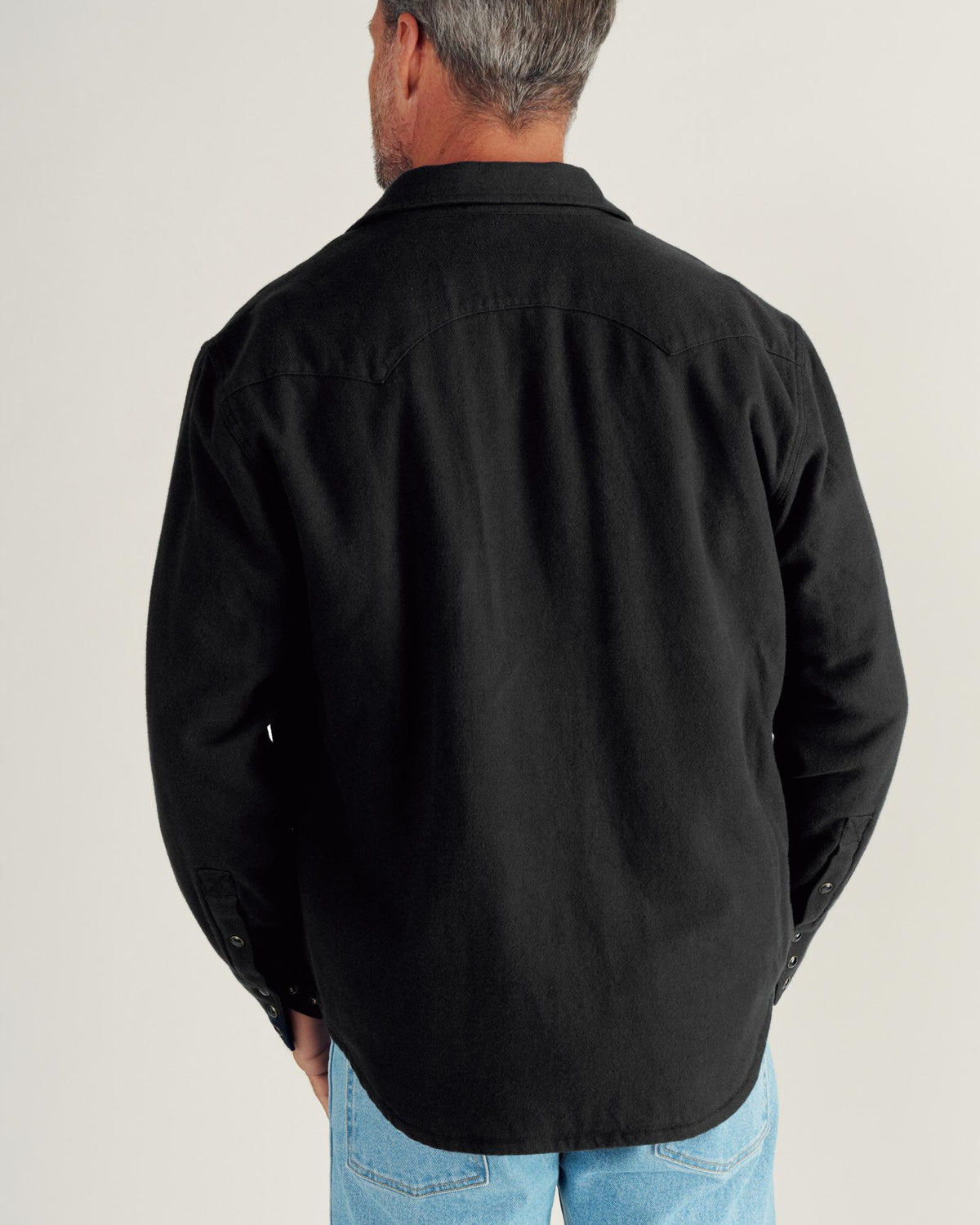 Closeup detail view of Men's Sawtooth Pearl Snap Shacket - Black