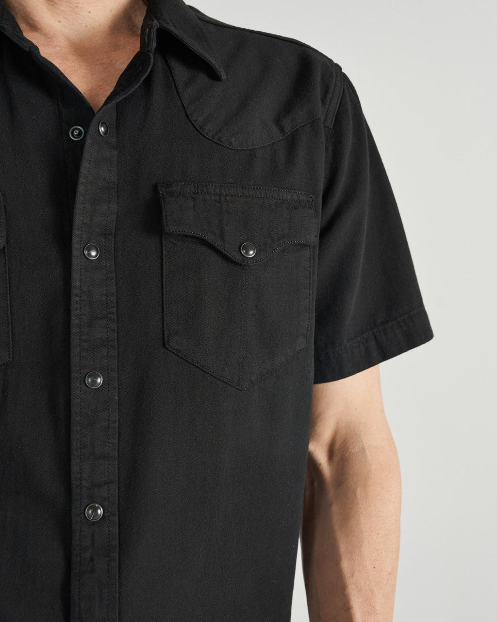 Closeup detail view of Men's Denim Pearl Snap SS - Black