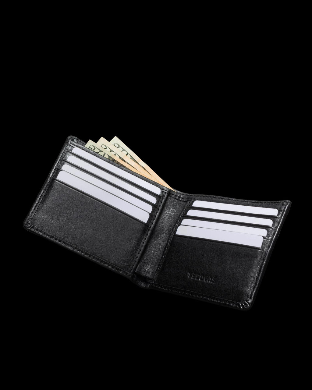 Open black wallet with several card slots filled with white cards and cash peeking out from the bill compartment against a black background.