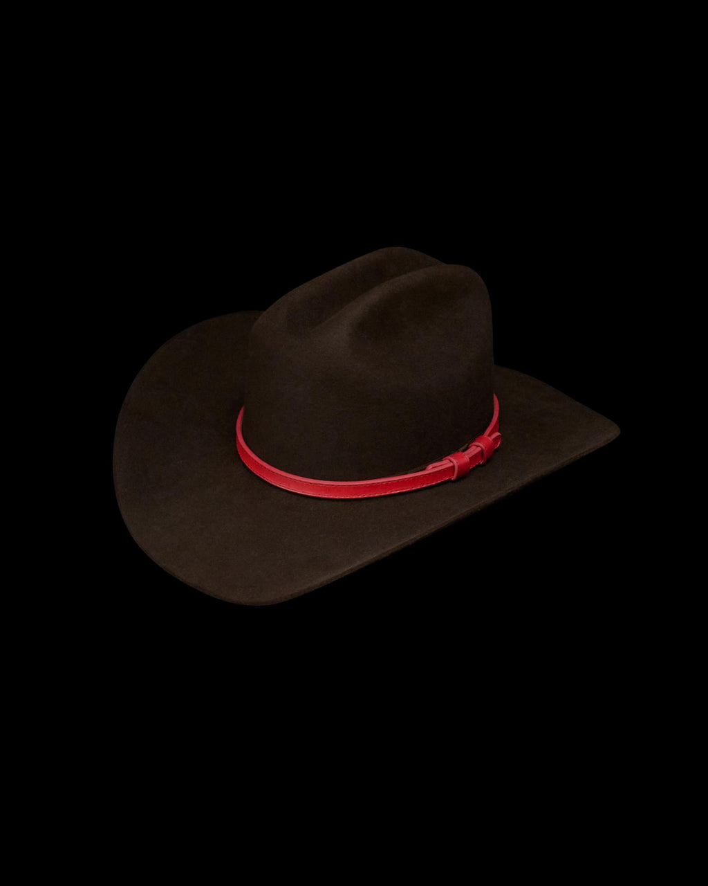 A dark brown cowboy hat with a wide brim and a red hatband, displayed on a white background.