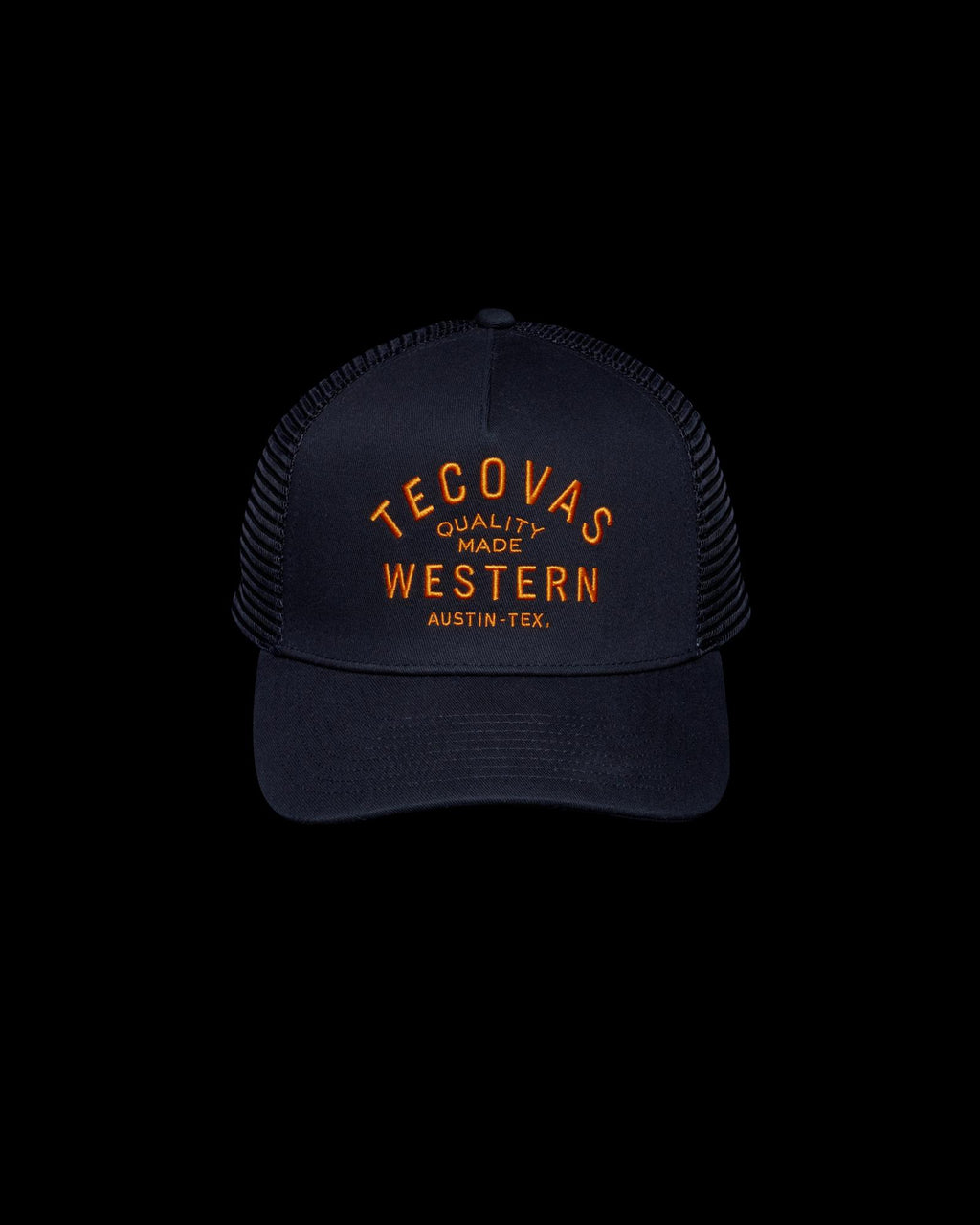 Front view of Quality Made Trucker Hat - Black/Orange on plain background