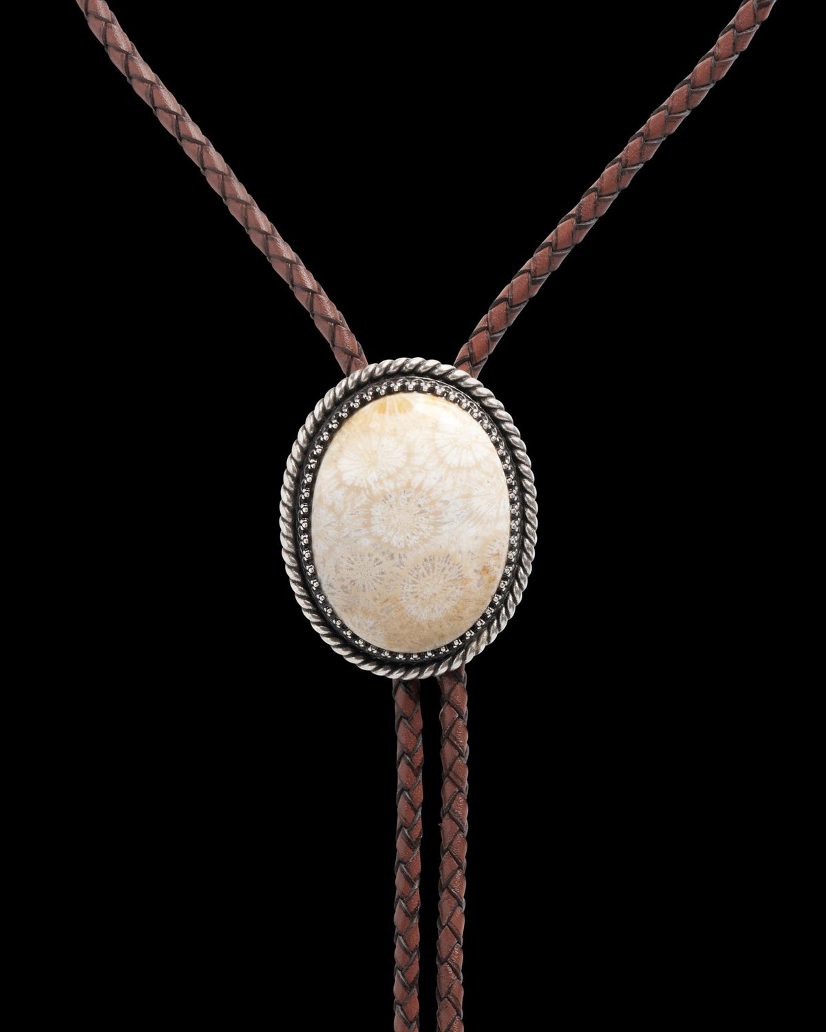 Closeup detail view of Iron Lamb Fossilized Coral Bolo - Cream / Black