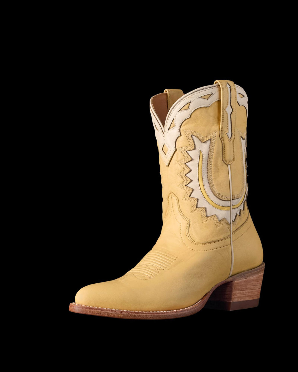 Quarterfront view of The Jolene - Pale Yellow Cowhide on plain background