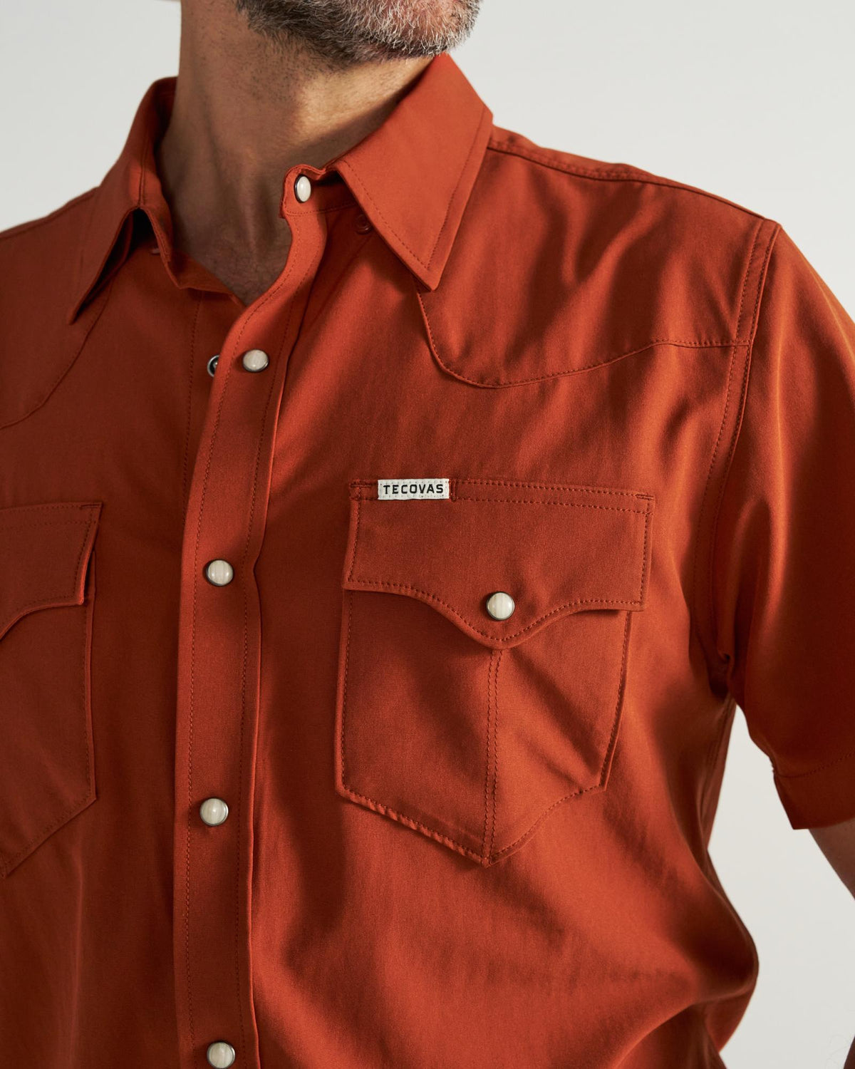 Closeup detail view of Men's Performance Western Pearl Snap SS - Orange Rust