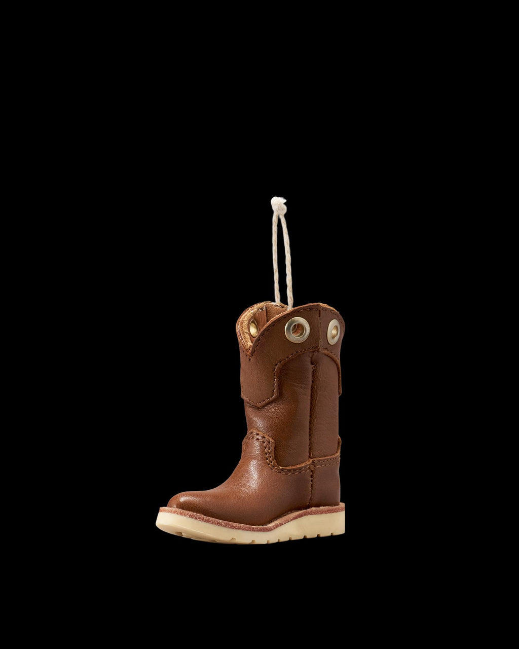 Quarterfront view of LongHaul Roper Work Boot Ornament - Saddle on plain background