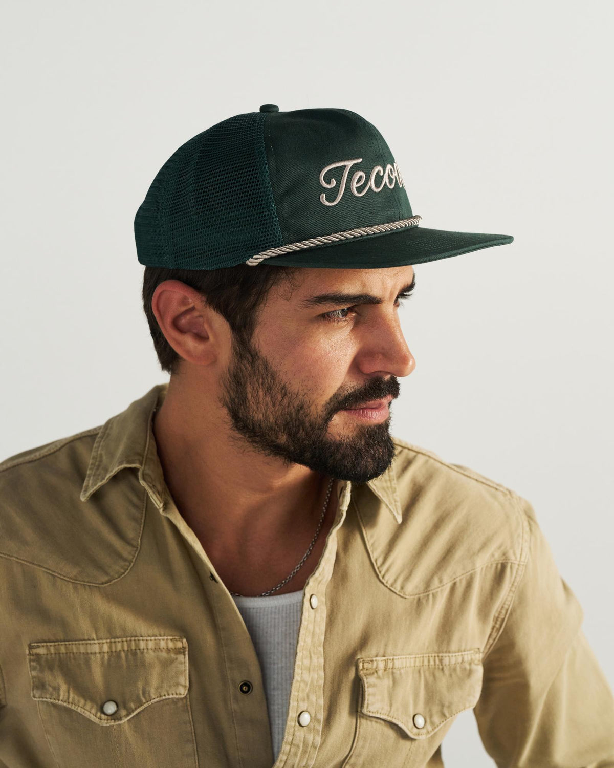 Front view of Tecovas Flat Brim Trucker - Dark Green on plain background