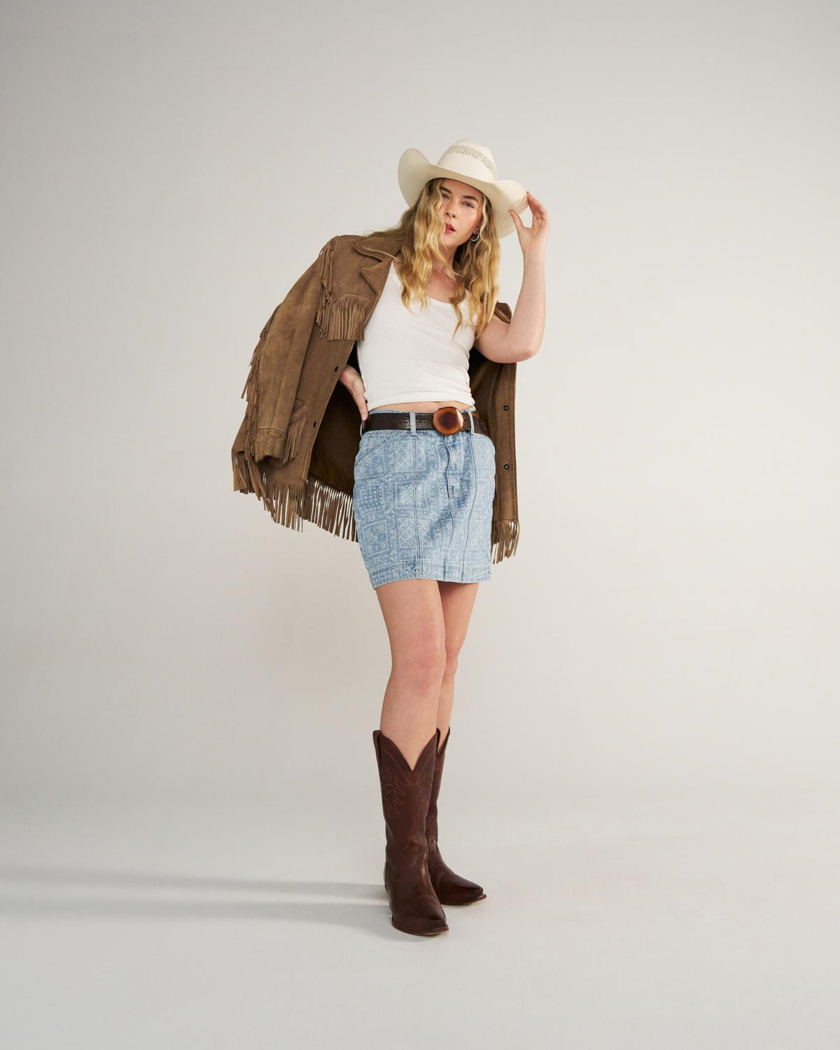 Full view of Women's High-Rise Denim Mini Skirt - Blue Bandana on model