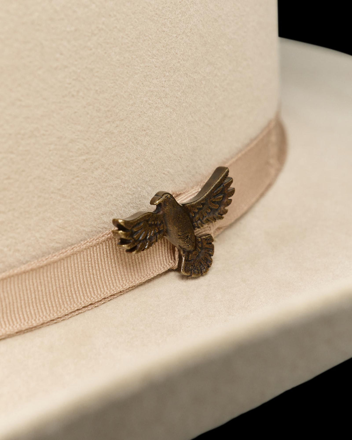 Closeup view of Hawk Hat Pin - Antique Brass