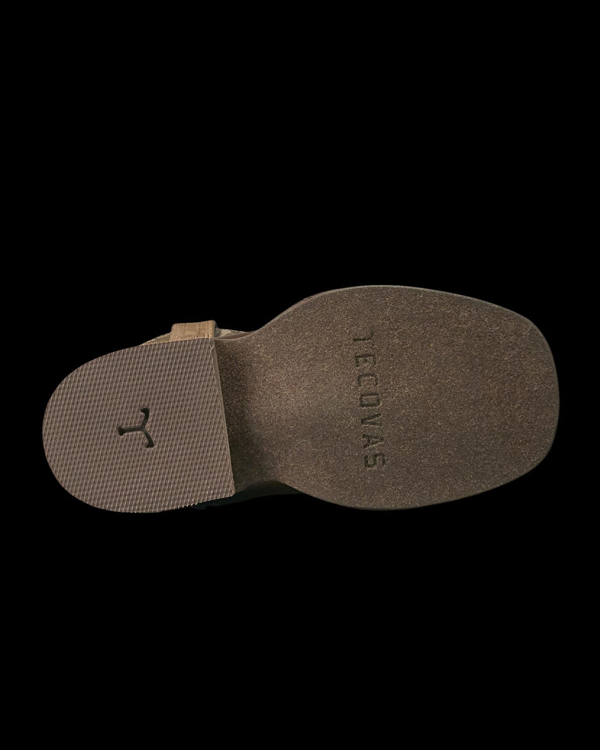 The photo shows the bottom sole of a brown boot with “TECOVAS” embossed near the heel and a textured area near the toe.