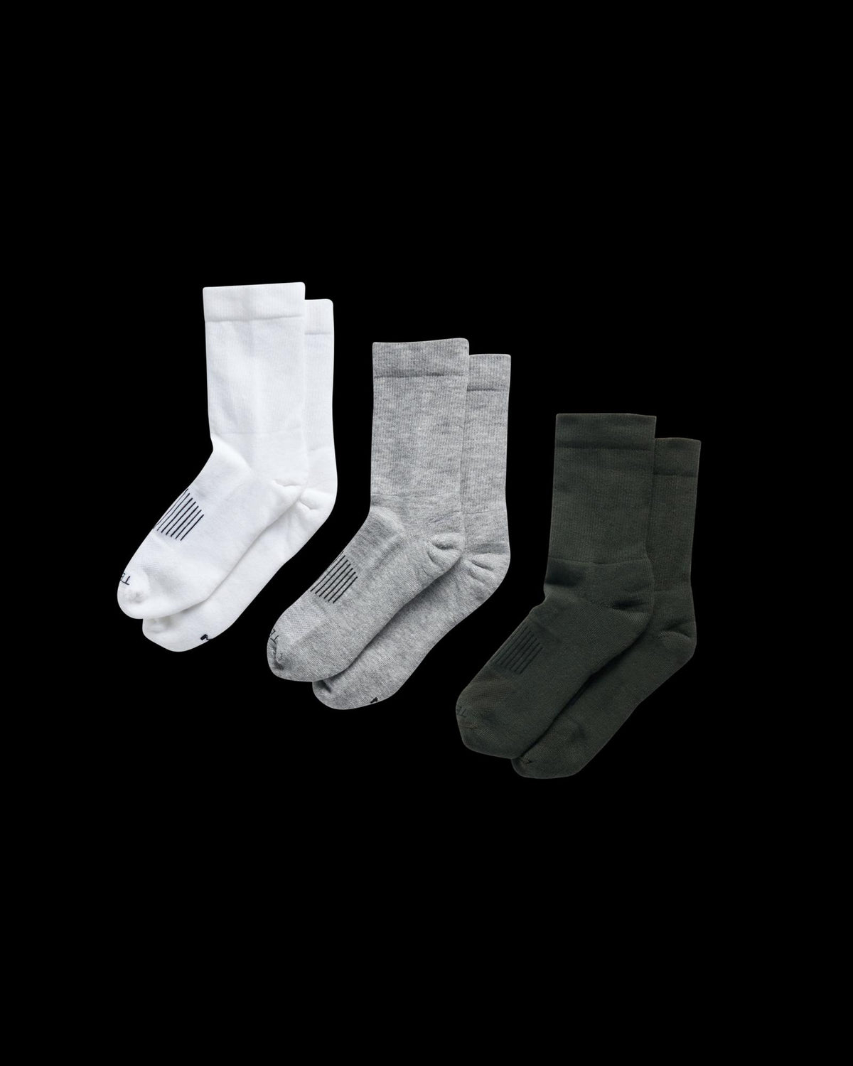 Quarterfront view of Crew Socks (3-Pack) - White / Green / Light Gray on plain background