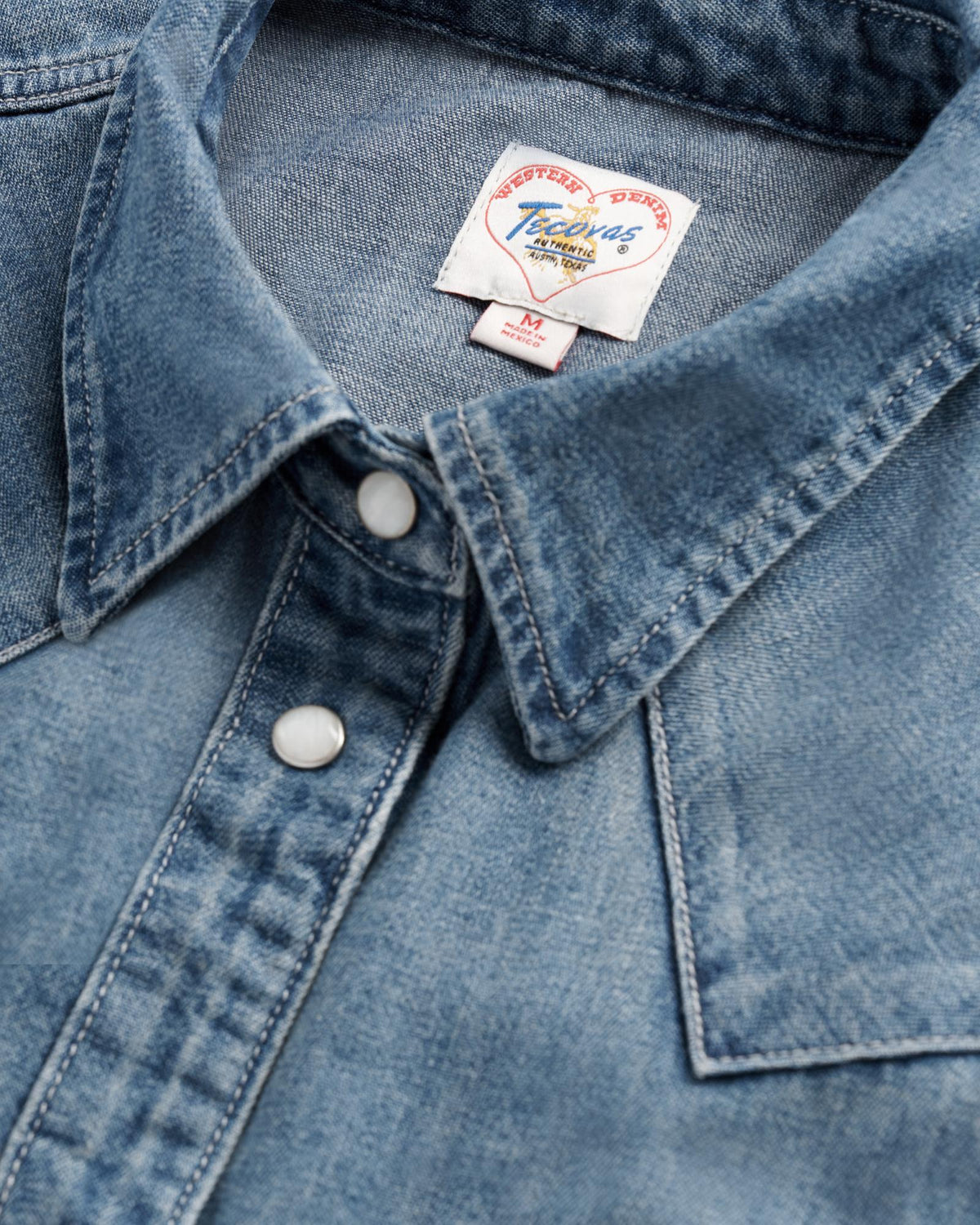 Closeup detail view of Women's Denim Pearl Snap (III) - Medium Wash