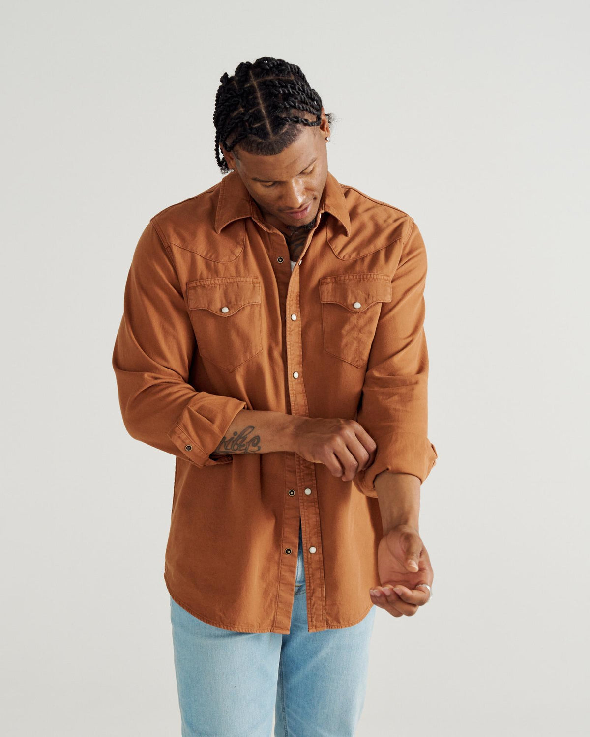 Closeup detail view of Men's Denim Long Sleeve Pearl Snap - Rust