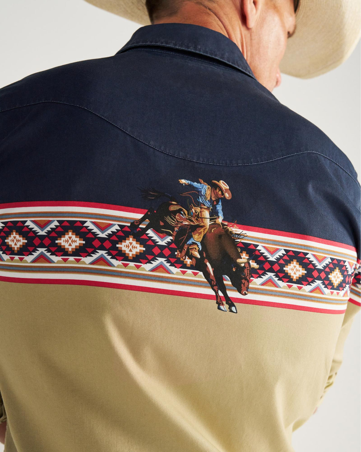 Closeup detail view of Men's Thorn Stopper Pearl Snap LS - Navy / Khaki
