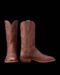 A pair of brown leather cowboy boots with decorative stitching, shown from the front and side against a white background.