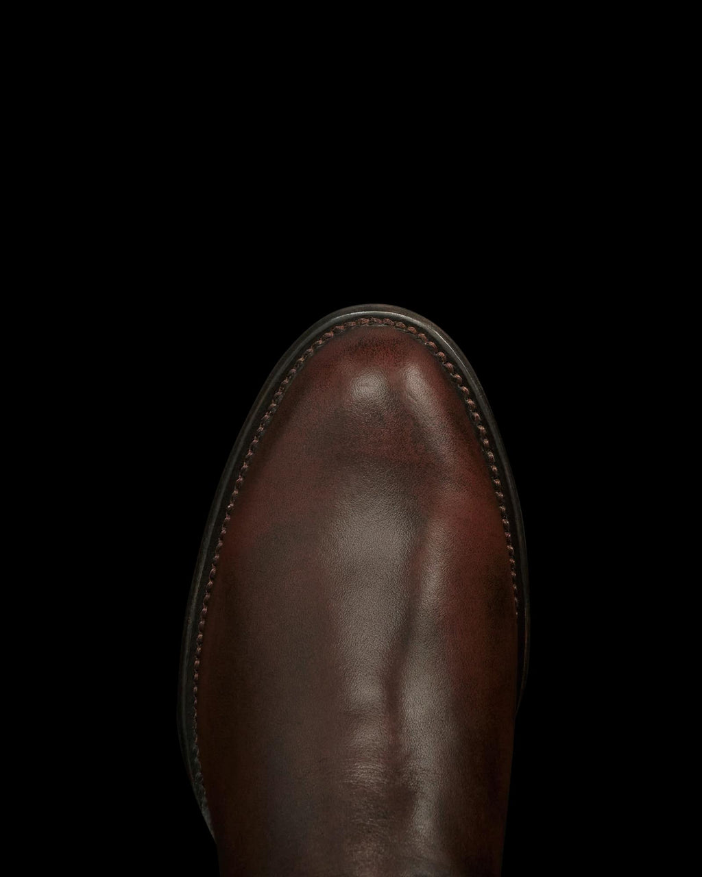 Toe view of The Dean - Iced Tea Cowhide on plain background